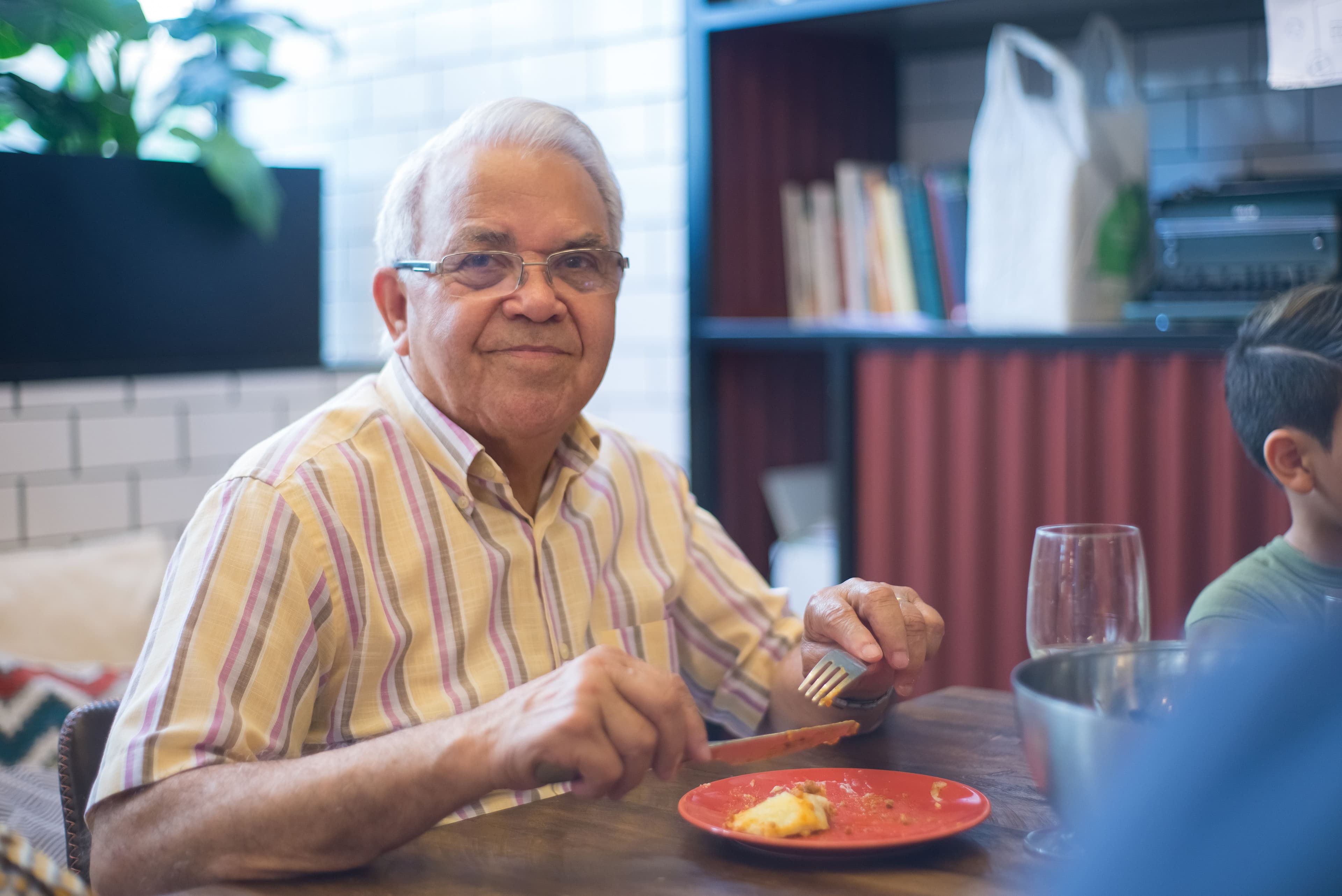 Resident sharing a meal with a visitor